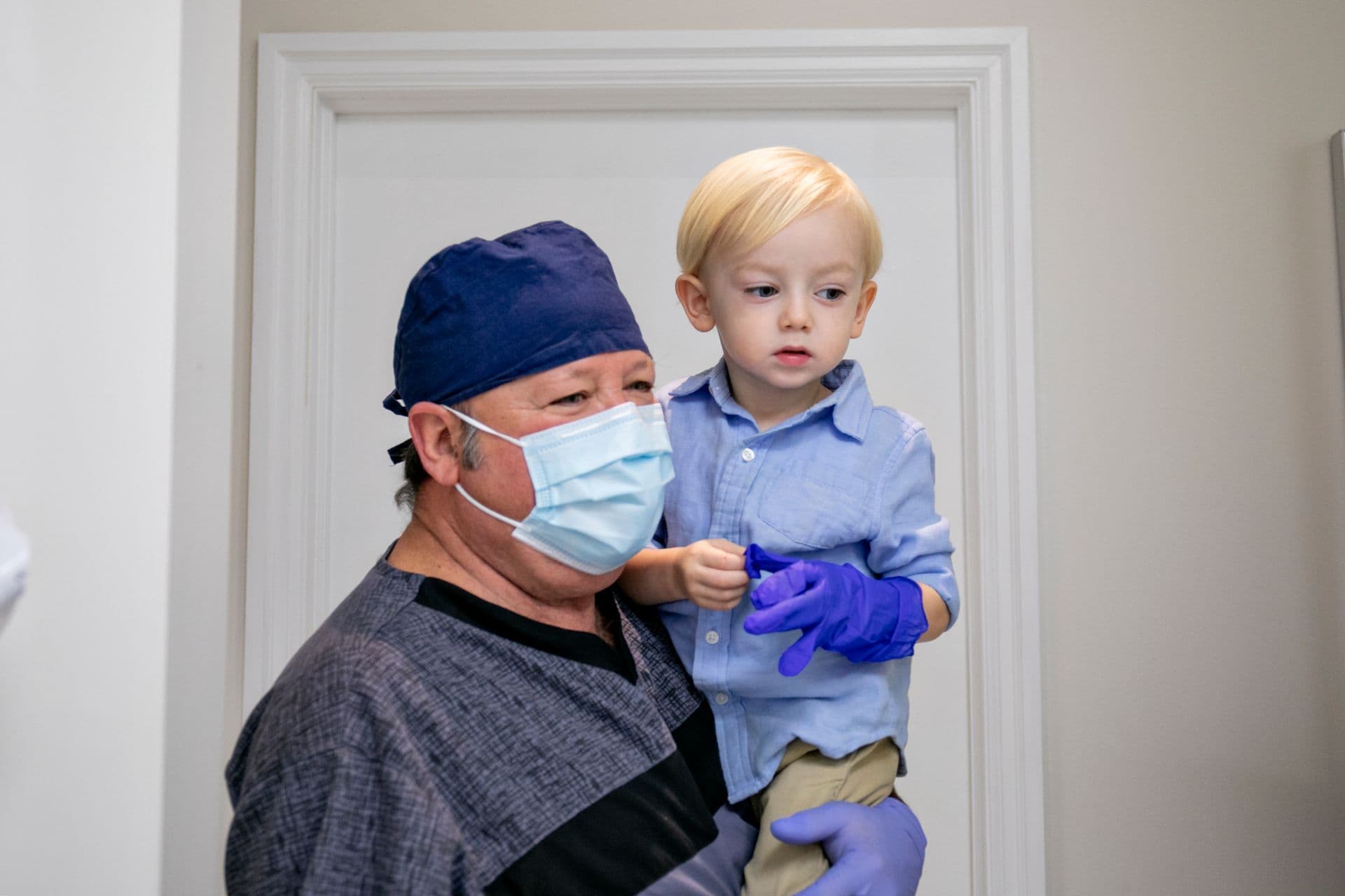 Dr. Ramirez with a young patient in the clinic
